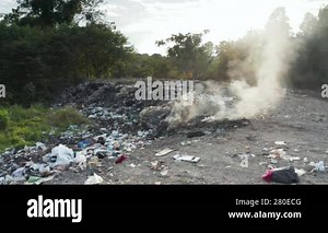 Garbage, fire burning and smoke in landfill. Also called trash, waste, rubbish. Destruction with combustion, heat, flame. Effect to environmental i.e. air pollution, toxic, disaster and global warming Stock Video Footage - Alamy
