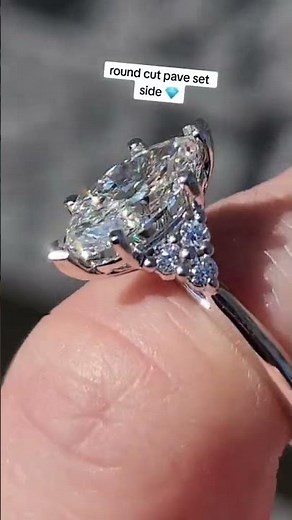 1.5 carat marquise cut diamond set in a contemporary pave engagement ring setting #engagementring