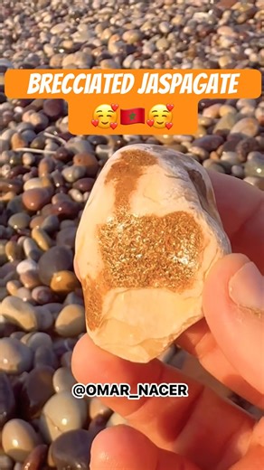 Look at these golden fragments locked inside the white stone. It’s a mosaic of the earth's strength.