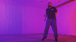 Break dance dancer with muzzle in dim light - Free Stock Video