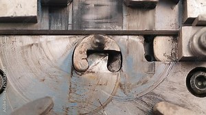 Close up of robotic automatic machine making steel metal, metallic parts tools manufacturing line production factory