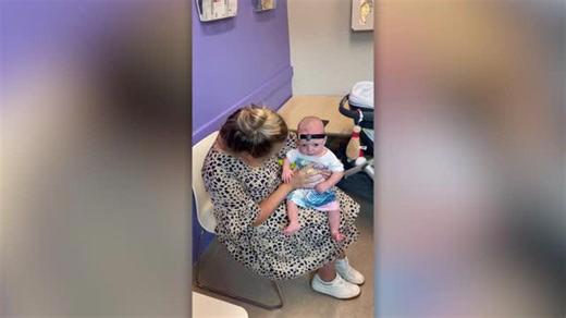 Infant experiences mother's voice for the first time using a hearing aid
