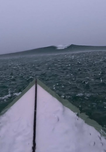 Surfing Under Rainy Waves: A Thrilling Experience