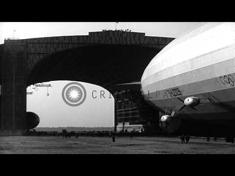 German airship, LZ 129 Hindenburg, maneuvered into hangar at Lakehurst Naval Air ...HD Stock Footage