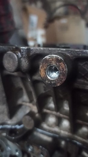 Close-Up of Engine Bolt and Nut in Workshop Setting