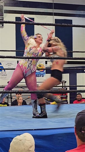 Avery Austin with a distraction allows Reese Ramone to use her baton on Mika at ACW.