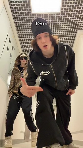 Synchronized Dance Routine in Modern Corridor