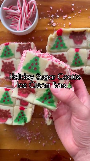 HOLIDAY SUGAR COOKIE ICE CREAM SANDWICHES 🎄 ❄️ These cookie ice cream sandwiches are easy to make and sure to be a hit at your next holiday party! All you need to do is line up Pillsbury themed cookie dough in two separate cake pans over parchment paper, then press them down so they all touch. Feel free to mix up the cookie doughs! Scoop the ice cream of your choice into a separate cake pan (over parchment paper), smooth it out to create the middle layer, and freeze for at least an hour. Once t
