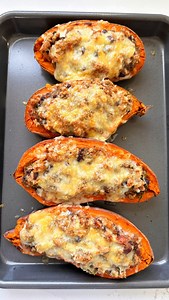comment “TACO” for these TACO STUFFED SWEET POTATOES! day 10 of 30 days of easy dinner ideas. this may be one of the ugliest recipes i have ever shared but it is one of the most delicious!! these taco stuffed potatoes are LOADED guys. they have black beans, zucchini, cheese and tons of spices and flavor. such a unique dinner idea to switch up the usual taco night and make it more veggie-forward. you can really just any ground meat you want as well - ground turkey, beef or chicken are all great o