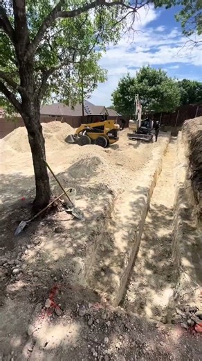 Phillips Driveways & Excavation is out on site digging footers for a 100+ foot retaining wall