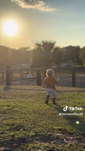 Adorable Boy in Cowboy Boots Stomps Around the Barn