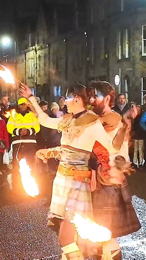 Members of Scottish fire show PyroCeltica blazing a trail through the streets of Inverness, as they took part in the Red Hot Highland Fling Hogmanay celebrations a couple of years ago. PyroCeltica are a pioneering brand of Celtic Fire theatre; their flaming performances are a fusion of Circus, Music, Dance and Theatre. They perform throughout Scotland and internationally, with a 20 strong crew of time served performers and safety technicians. #pyroceltica #fireshow #inverness #hogmanay | Scottis