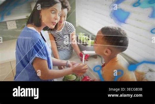 Mother handing pepper to boy, guiding rinsing at sink for food prep with blue overlays appearing Stock Video Footage - Alamy