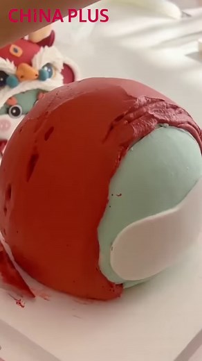 6.7K views · 28 reactions | Inspired by the traditional Chinese lion dance, a cake maker created a lion-shaped cake using colorful decorations to showcase her creativity. In Chinese culture, lion dance performances convey auspicious wishes and blessings to the public on festive occasions. #SharedFuture10Years #Heritage #Happy2024 #YearOfLoong #Delicacy | China Plus Culture | Facebook