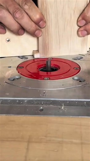 Cutting precise finger joints in a wooden board using a router table for strong furniture assembly
