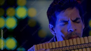 Close Up Shot Of Musician Playing Pan flute Instrument From Andes Of Peru And Bolivia