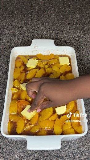 Let’s make. Sweet treat ! Peach cobbler peach dumpcake whatever you want to call it it’s delicious!! 1 box of Butter Cake mix @bettycrocker 4 cans of peaches in fruit juice (drain 3 ) only use 1 with the juice 1 cup granulated sugar 1/2-1 cup of brown sugar (taste it for sweetness) 1 tablespoon vanilla extract or vanilla bean paste 1 tablespoon pumpkin spice ( or use cinnamon & nutmeg ) Bake on 350 for about an hour uncovered or until crust is brown and crispy #peachcobbler #dumpcake #peach #swe
