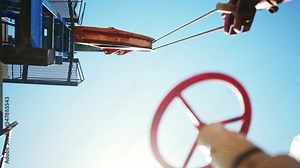 oil pump. oil rig mechanism pumping oil and gas. business industry concept. rig energy petroleum barrel. sunlight oil pump pumps from the ground business finance concept