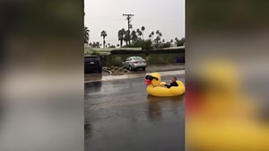 Boy Rides Huge Inflatable Rubber Duck In A Middle Of The Street