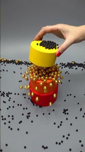 Colored Tower of Black Plastic Beads and Gold Beads Seven Wooden Cups (Oddly Satisfying)