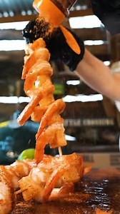 GRILLED TERIYAKI SHRIMP & PINEAPPLE SKEWERS - By Grill Masters Club 🏆 SERVES: 4 PREP TIME: 20 MIN COOK TIME: 6-8 MIN INGREDIENTS 1/3 cup Everyday Black Garlic Teriyaki by Saucy Rascals (plus extra for serving) 1=2 Tbsp Mis' Rubin's Fish Magic Seasoning 1 lb Large Shrimp, peeled and deveined 1.5 Cups Pineapple Chunks Tbsp Olive Oil Skewers (if wooden, soak in water for 30 minutes) 1 lime INSTRUCTIONS *1. If you're using wood skewers, be sure to soak them in water for at least 30 minutes to preve