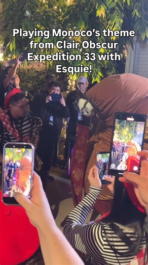 Carlos Eiene on Instagram: "Incredible spontaneous moment getting to jam over Monoco’s theme from Clair Obscur: Expedition 33 at the Baguette meetup at MAGFest! The incredible Esquie is by @miakat.cos! I showed up with my sax for fun and this all just kinda happened!"