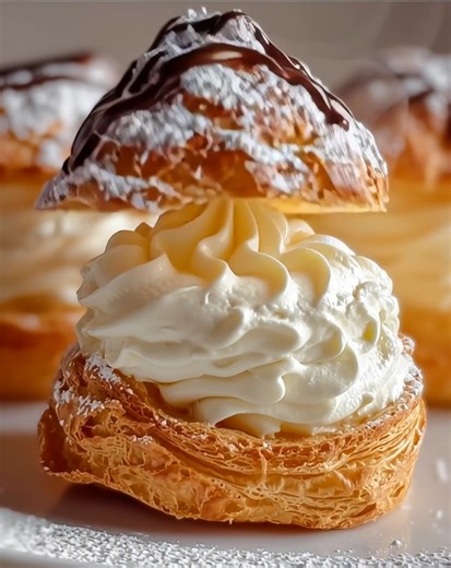 Special Italian Cream Puffs with a Twist 🍰✨ Whip up these delightful Italian cream puffs that'll impress your guests and satisfy your sweet tooth! Get ready to treat yourself! 🎉 Ingredients: - 2 cups whole milk - ½ cup granulated sugar - 1 sheet puff pastry, thawed Instructions: 1. Preheat your oven to 400°F (200°C). This will ensure your puff pastry rises beautifully as it bakes. 2. In a medium saucepan, combine the whole milk and granulated sugar over medium heat. Stir until the sugar dissol
