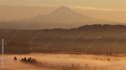 The scenic Mount Hood rises from the forested landscape of northern Oregon. This iconic Pacific Northwest mountain is part of the Cascade Mountain Range.