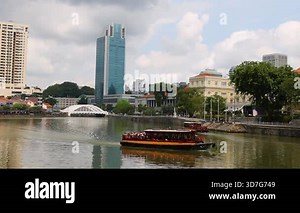 Tourist boat cruising along a city river.