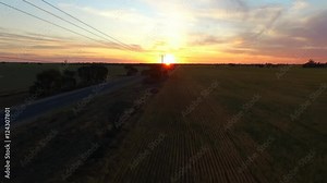 Aerial view of outback highway or open road on dusk (sunset) with truck traveling on rural country high speed freeway or motorway driving scenes on open road. Stock Video