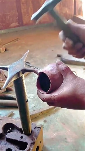 Traditional Metalworking Expert Hand Forging of a Copper Pot and Spout