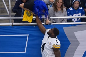 Video: DK Metcalf Punches Lions Fan in Blue Wig - BlackSportsOnline