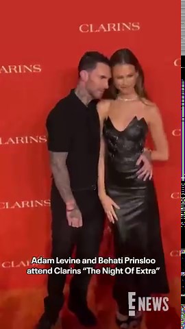 Adam Levine and Behati Prinsloo pose on the red carpet