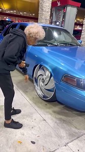 She Checking out the DUB Skates on the Bagged Ford Crown Vic