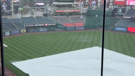The rain is not stopping Shohei Ohtani from getting his pregame throwing work in though
