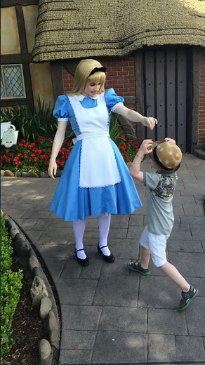 Walt Disney World May 2015 trip:Quinn meets Alice at Epcot and helps her find her carrots!!