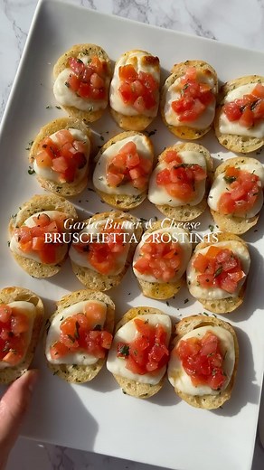 Bruschetta Crostinis | garlic butter crostinis toasted with cheese & topped with bruschetta! the perfect bite-sized appetizer to make for the holidays🎄✨ •sliced baguette •TJ’s bruschetta •melted garlic butter •sliced mozzarella •parsley or basil •balsamic glaze •top crostinis with garlic butter & mozzarella | then bake at 375 for 7-10 minutes #crostini #quickrecipes #appetizers #holidayrecipes #christmasrecipes #hosting #easyrecipes #snackideas | Shewillevolve