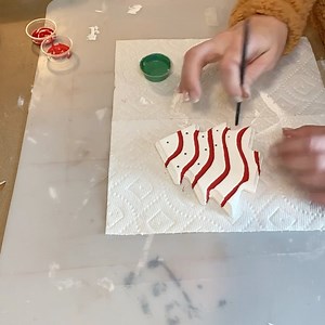 I made this adorable ornament last year using a wooden Christmas tree from Dollar Tree. All it took was a paint job and it turned out so cute! | The Celebration Co.