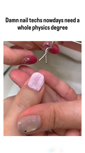 Explainer_Zone on Instagram: "The post showcases a 12-second video of a nail technician using a thin wire to precisely shape molten pink gel into intricate heart loops on a client's nails, set to upbeat music, emphasizing the technique's delicacy. Caption "Damn nail techs nowdays need a whole physics degree" humorously underscores the advanced precision involved, resonating with viewers through 53,000 likes and 4.4 million views since January 24, 2026. Replies highlight the fusion of artistry an