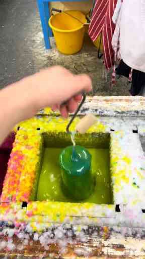 Dipping Cylinder Candles in Colored Wax