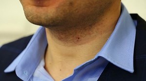 The tailor takes measures for a suit