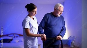 Nurse Assisting Elderly Man with Walker at hospital room, representing care and support in old age.