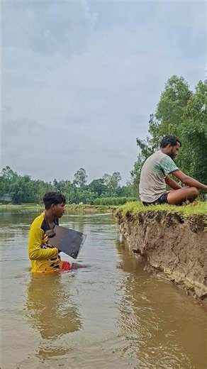 Two boys by the river