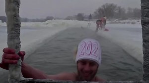 Siberians go swimming in ice-cold river