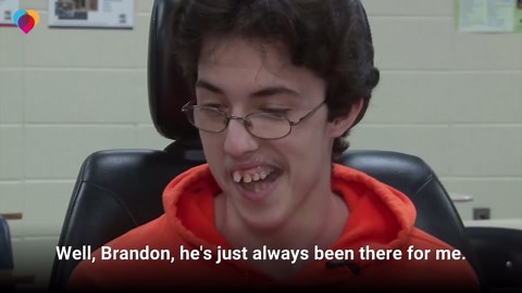 Teenage boy buys friend electric wheelchair