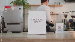 Business Cafe man put TAKE OUT ONLY sign at restaurant due to Covid-19