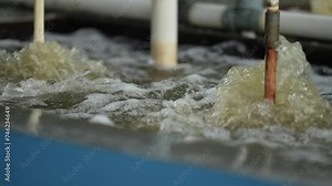 Close-up of the color mixing process in a water bath. The color mixing process for fabric dyes