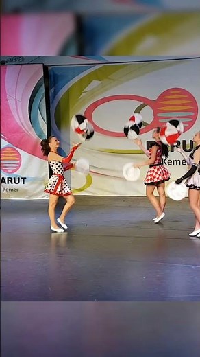 Mesmerizing Female Hat Jugglers: Acrobatics & Dance Spectacle