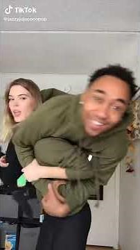 girl lift a guy on shoulder