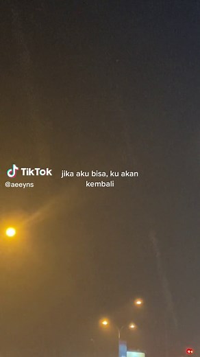 Nighttime City Street Scene with Illuminated Buildings